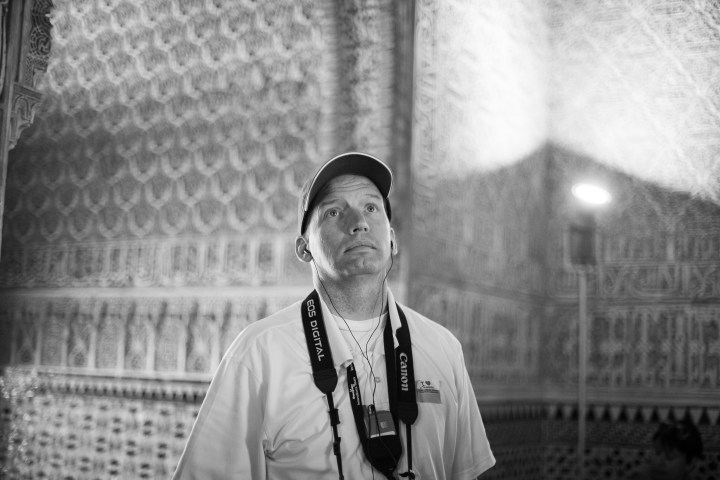 a man standing in front of a building