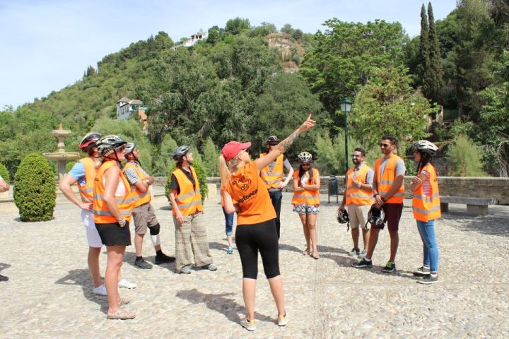 a group of people walking in the sand