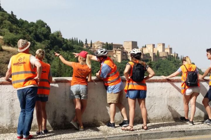 a group of people standing on a beach